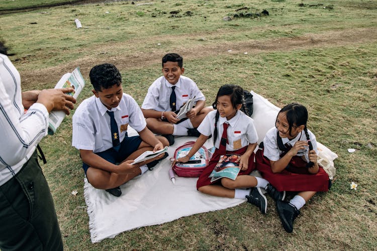 A Group Of Students Reading