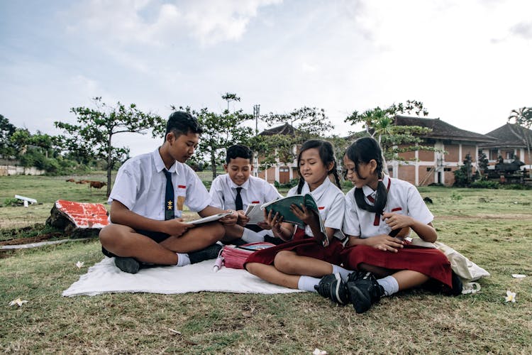 A Group Of Students Reading