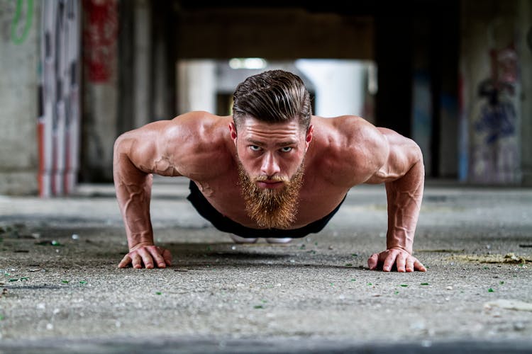 A Bearded Man In Push Up Position