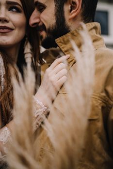 Woman in Brown Coat Holding Her Hair