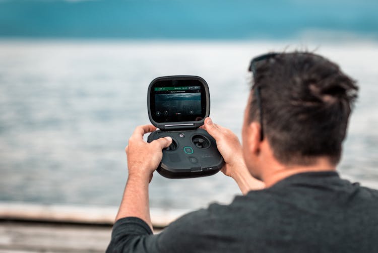 Man Operating Underwater Camera