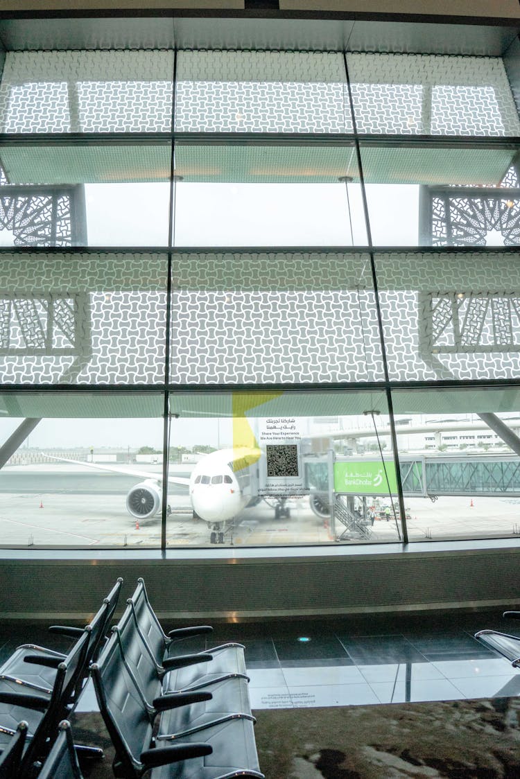 View Of An Airplane From The Lounge Of Airport