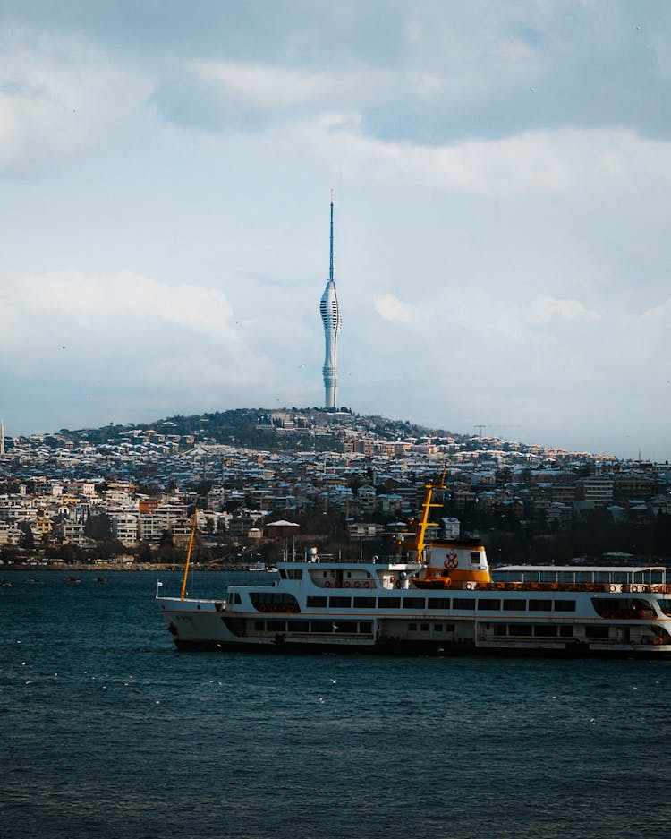 A White Ferry Sailing On The Sea