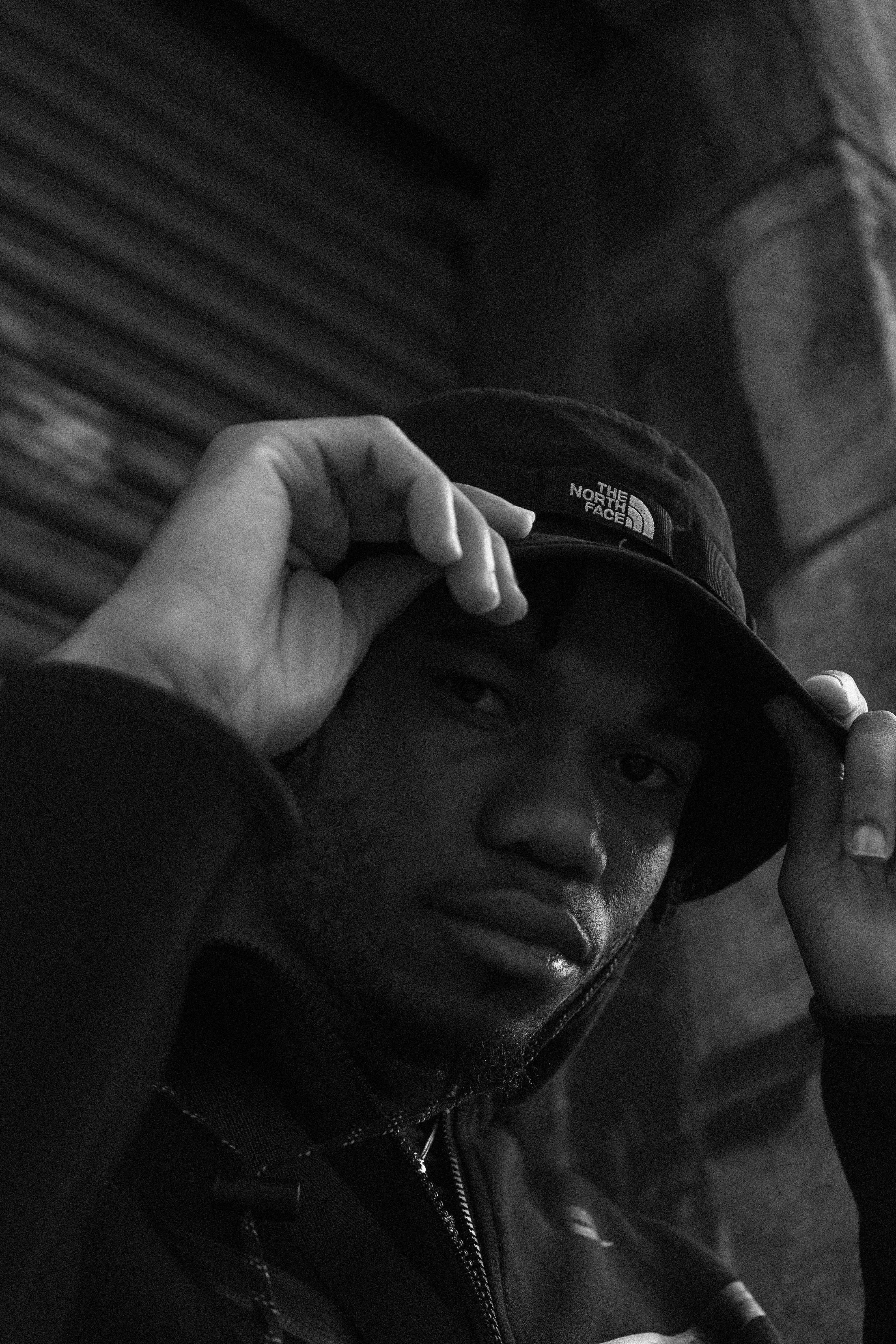 Smiling Man behind White Paper Wall · Free Stock Photo