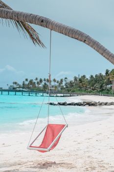 Red and White Sail Boat on Beach