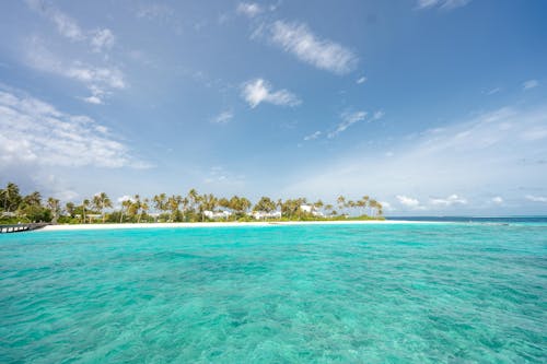 Turquoise Sea Water Under Blue Sky