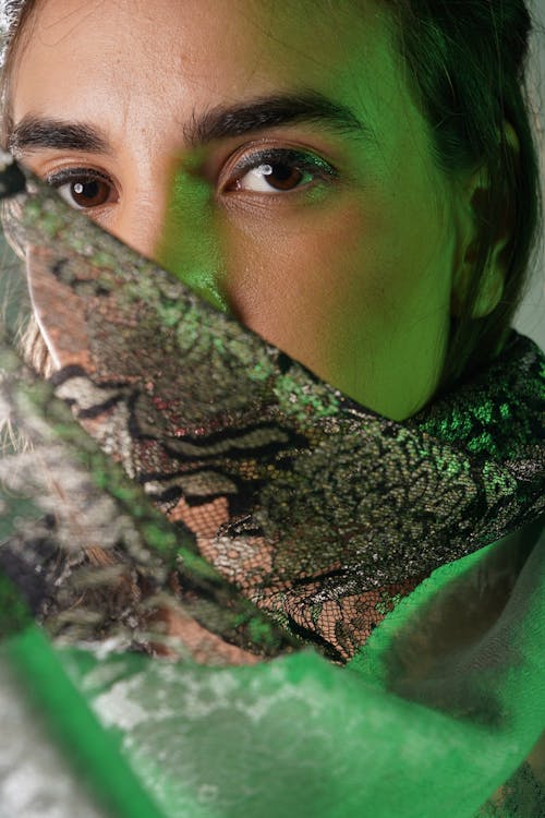 Woman in Glamour Makeup Wearing a Scarf 