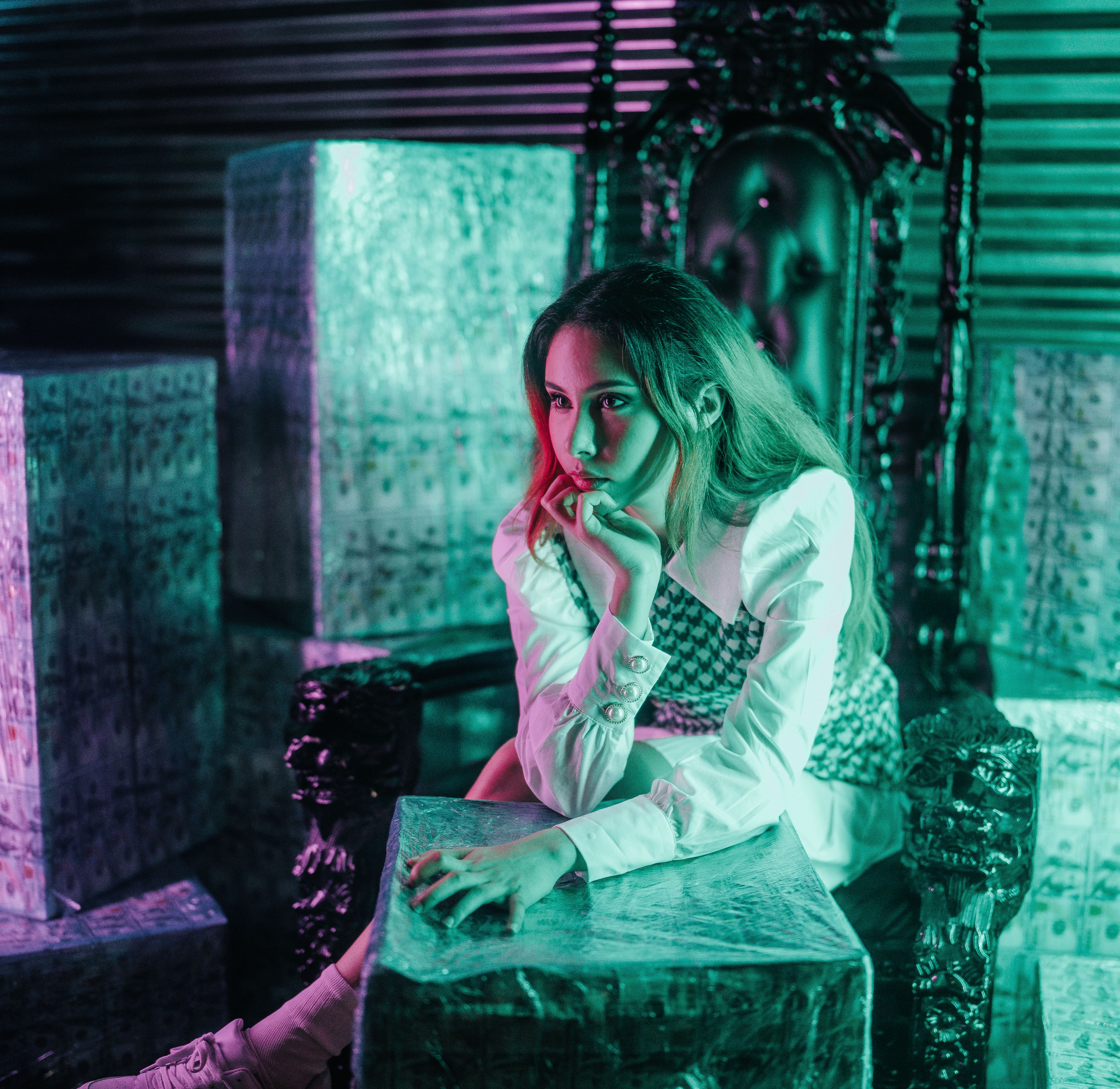 A Woman Wearing White Long Sleeves Sitting on the Chair · Free Stock Photo
