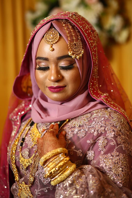 Free A Beautiful Bride Wearing Lehenga and Gold Bangles Stock Photo