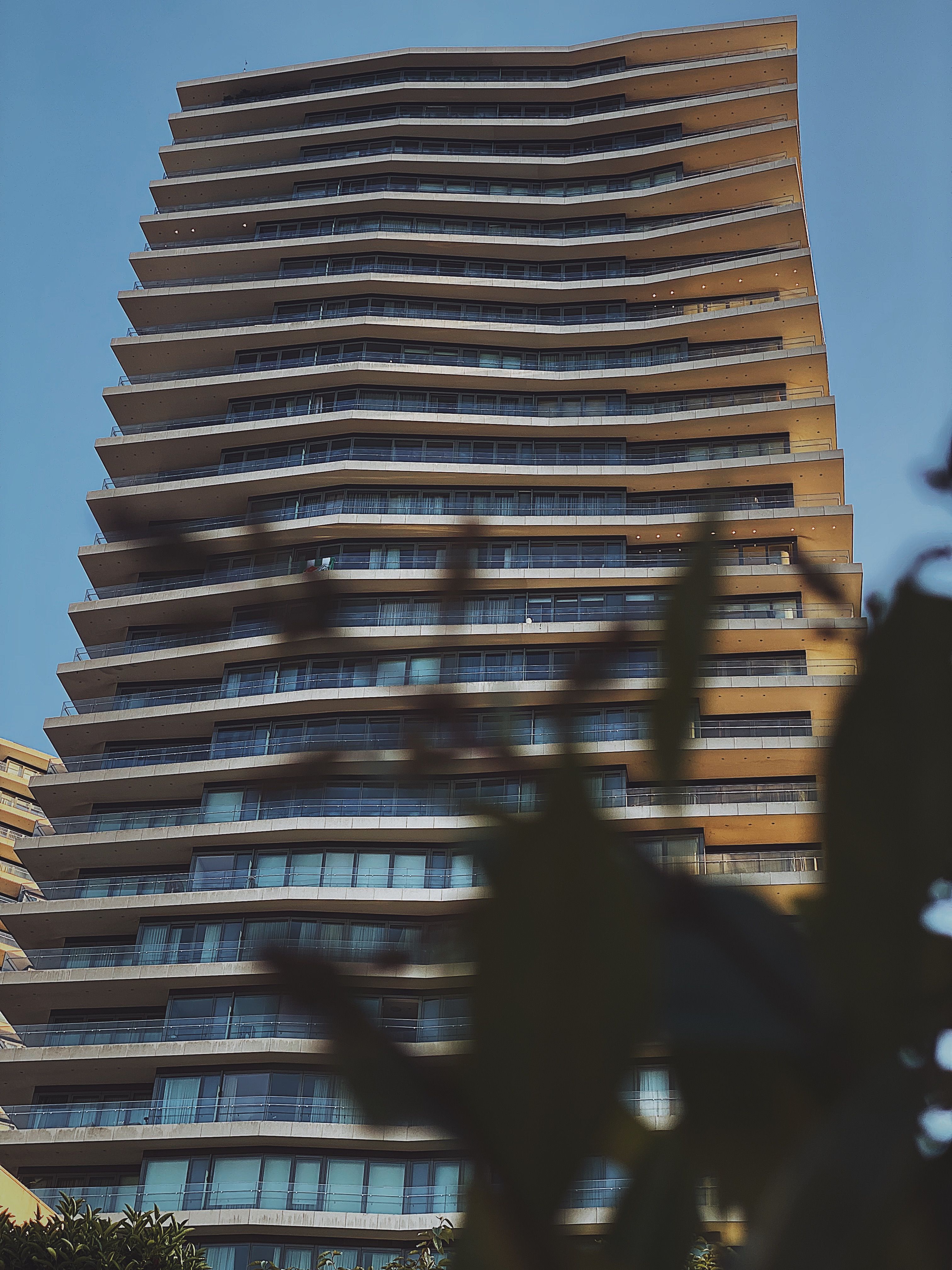 A Low Angle Shot of a Building Under the Blue Sky · Free Stock Photo