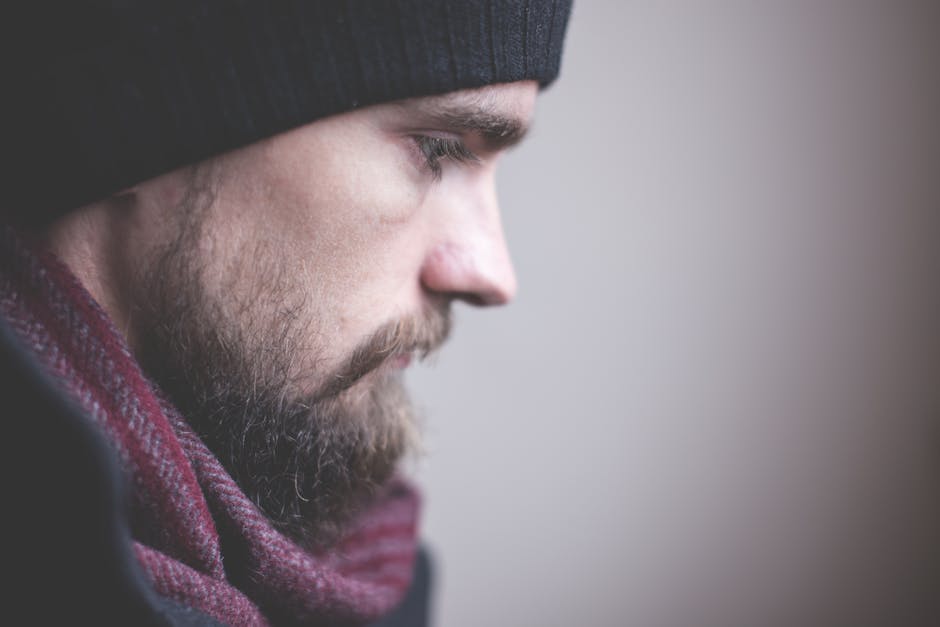 Man in Red Scarf and Black Nit Hat