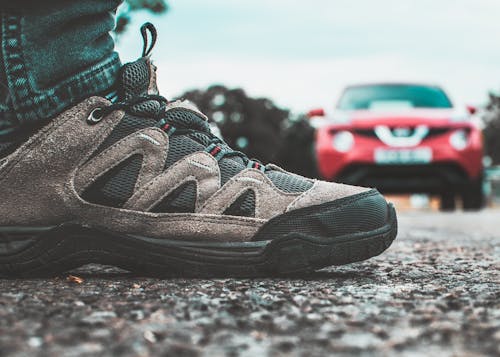 Free Black and Gray Shoe Near Red Vehicle Stock Photo