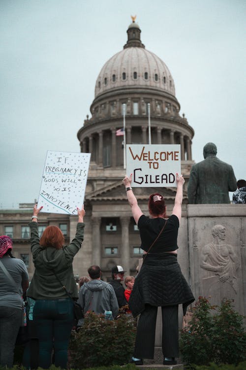 People with Banners in a City