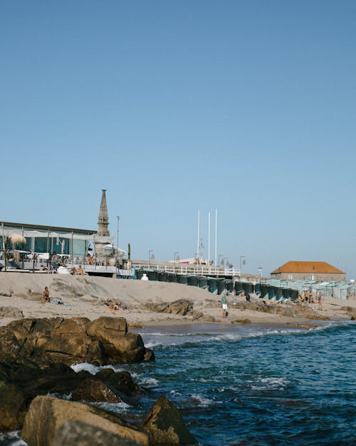 People on the Beach under a Blue Sky