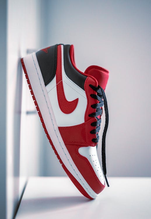A Nike Air Jordan Shoe on a White Surface · Free Stock Photo