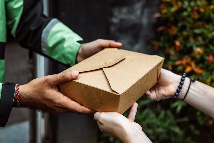 Delivering Food Box To A Customer