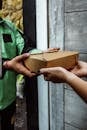A Man Handing a Package