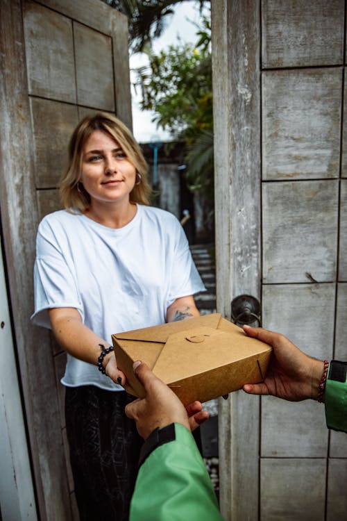 Woman Receiving Takeout Food