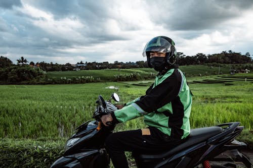 Man Riding on a Scooter 