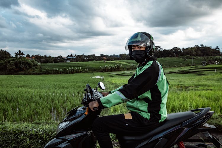 Man Riding On A Scooter 