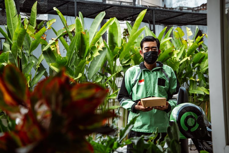 A Deliveryman Holding A Package