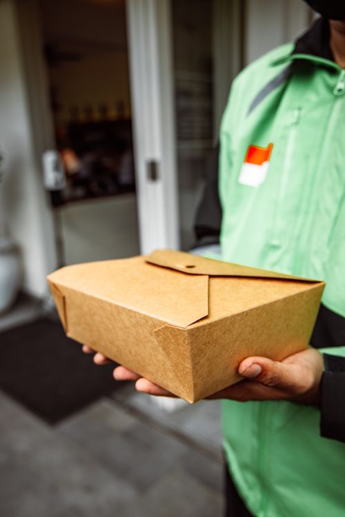 A Deliveryman Doing Food Delivery · Free Stock Photo