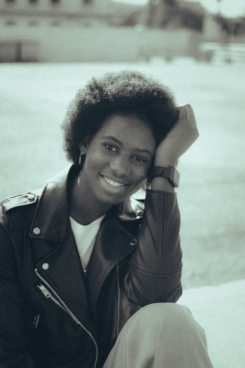 Close-Up Shot of a Woman in Black Leather Jacket Smiling