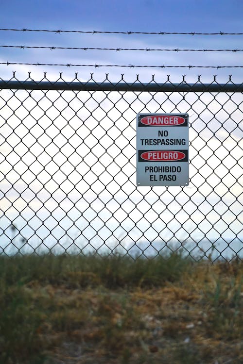 No Trespassing Sign on Metal Fence