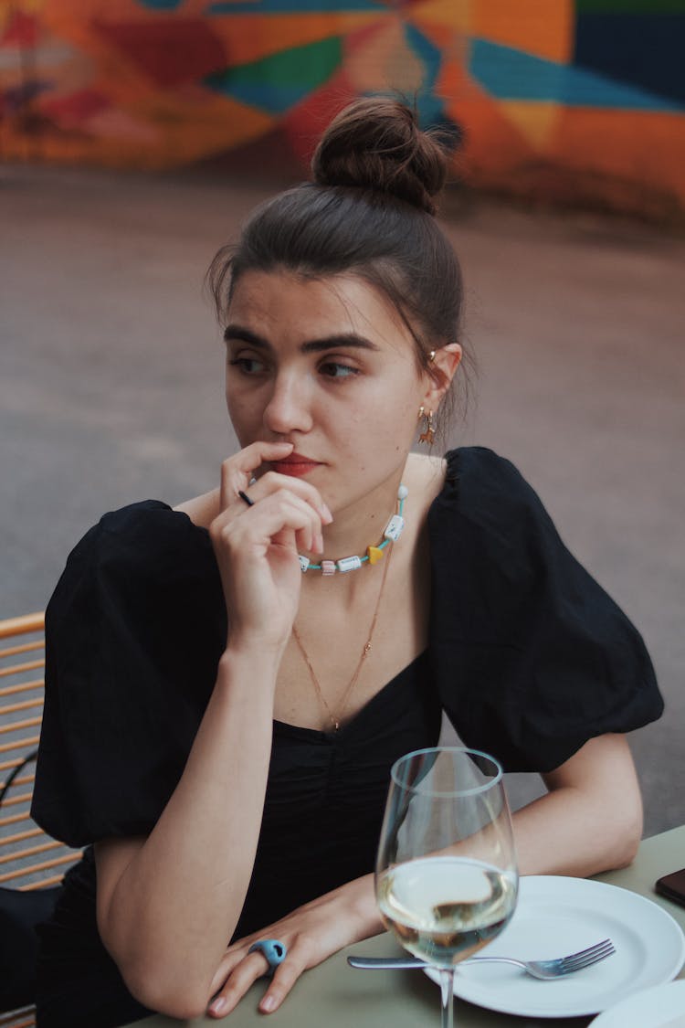 A Woman Thinking While Sitting 