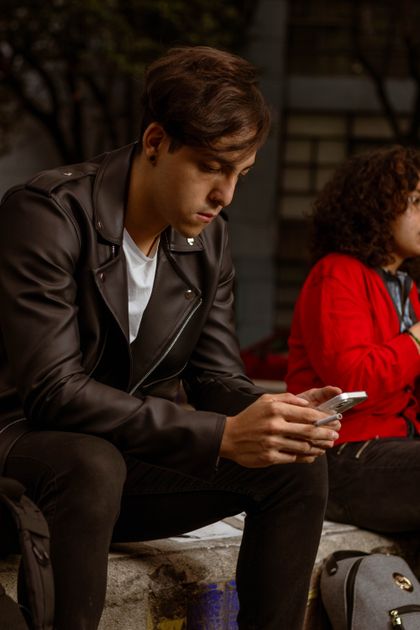 Two people with smartphones