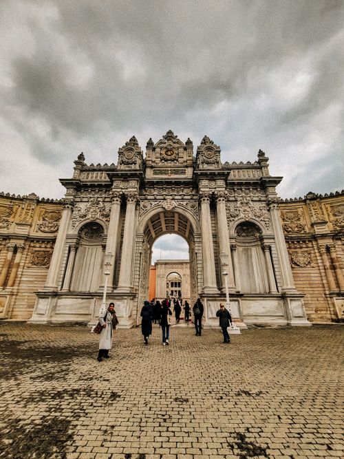 Free A stunning view of the ornate gate of Dolmabahçe Palace in Istanbul, showcasing baroque architecture. Stock Photo