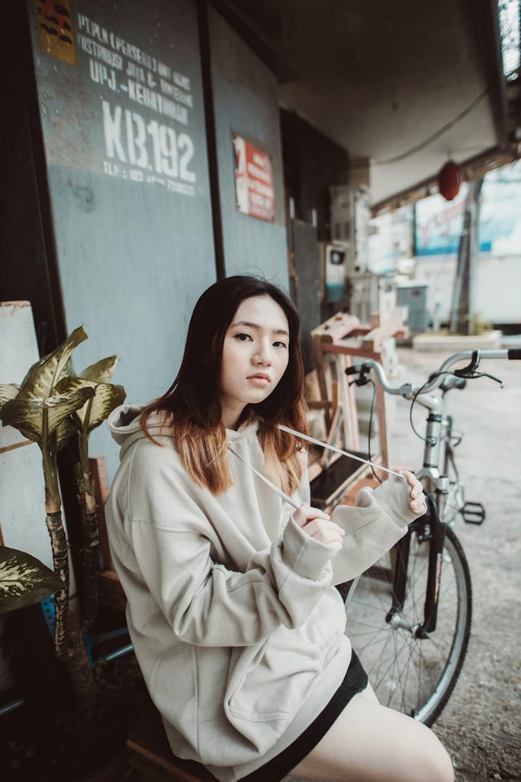 Woman In Hooded Blouse