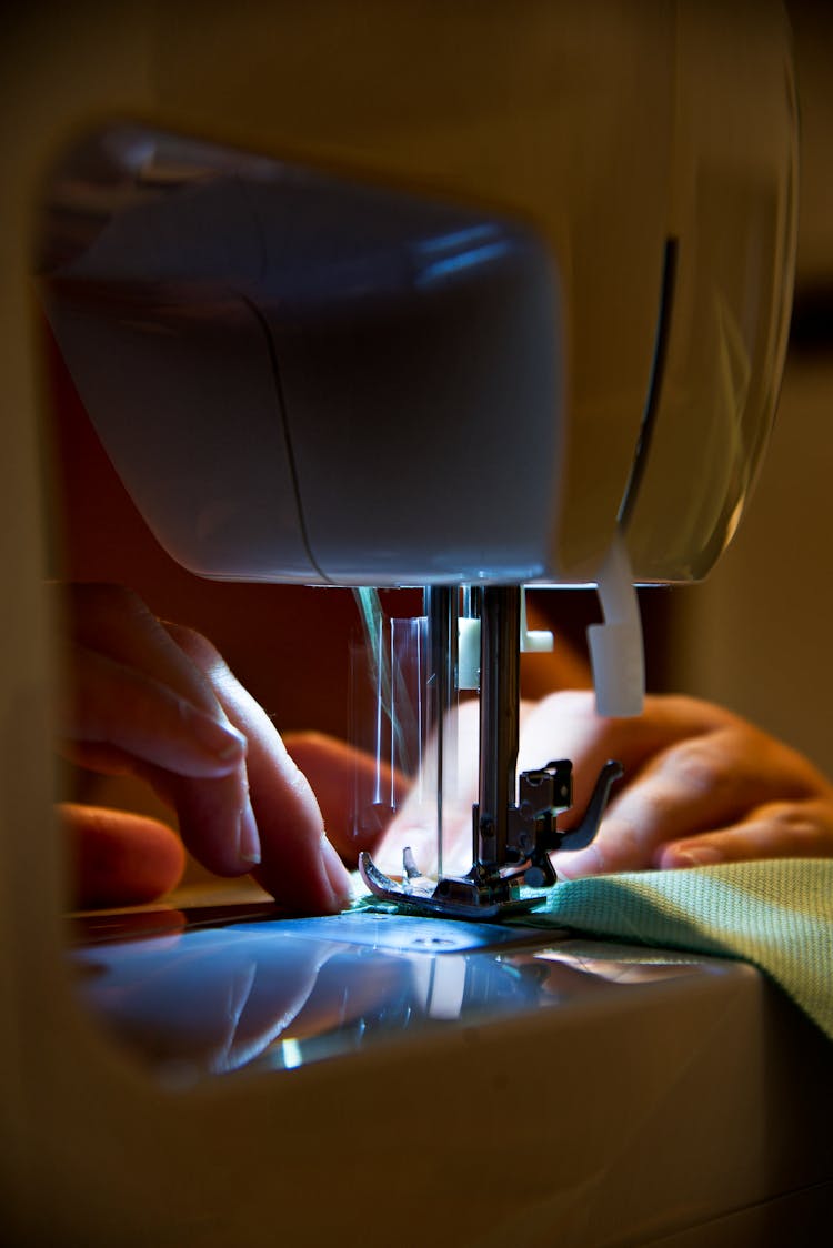 Spotlight Over A Sewing Machine Needle