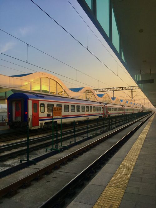 Free Electric train at a modern station in Ankara, Turkey during sunrise, showcases vibrant urban architecture. Stock Photo