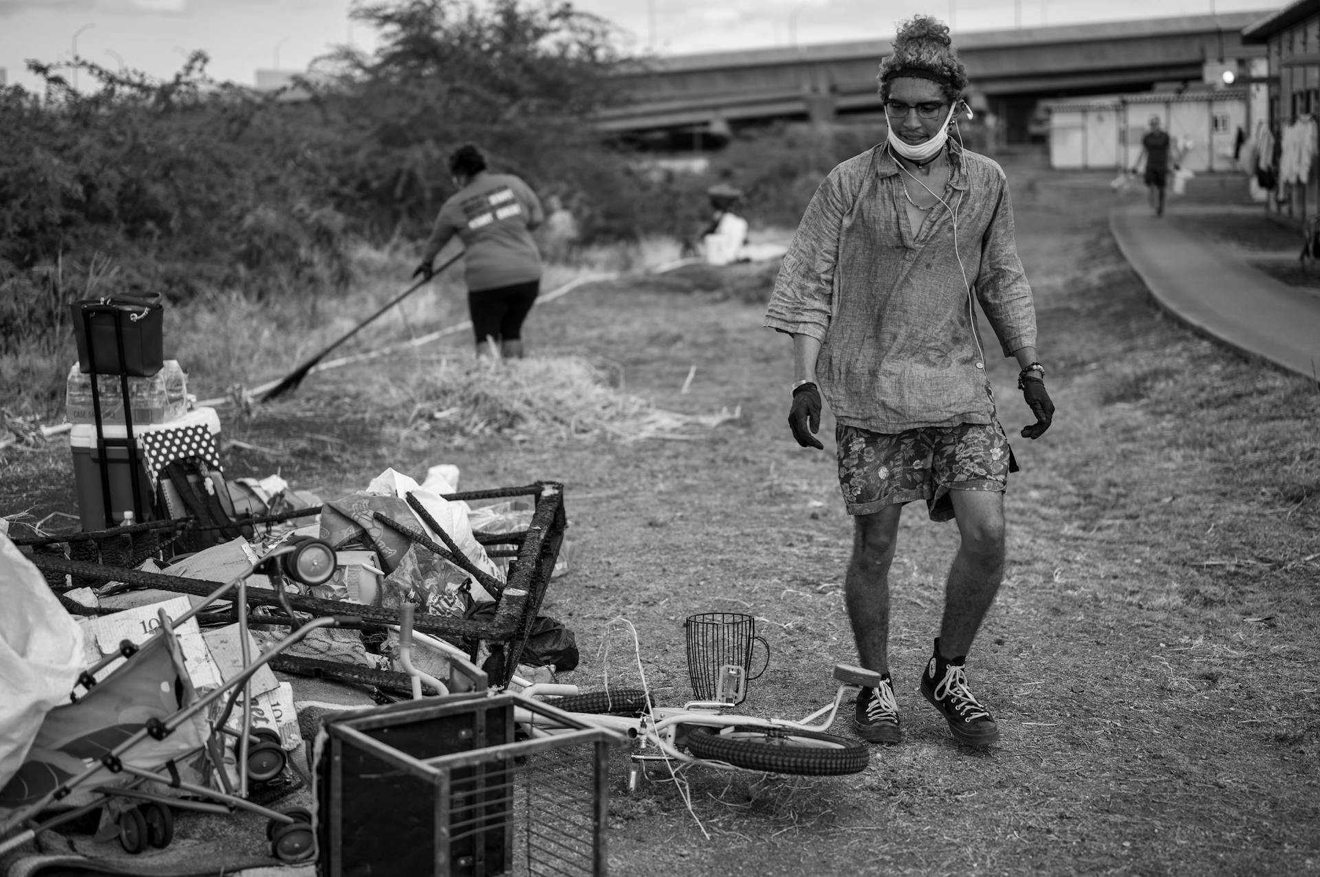 Volunteers clean up a public area, removing waste and debris, promoting environmental awareness.