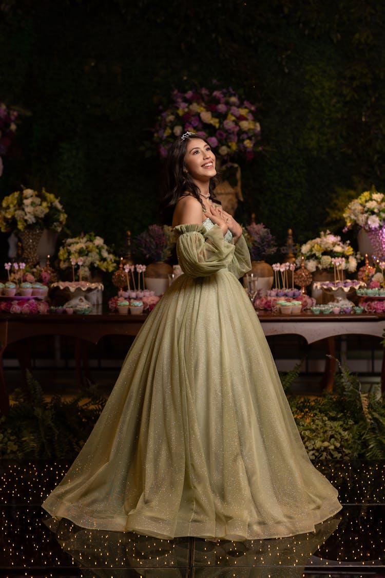 Woman In Princess Gown By Table Of Pastries