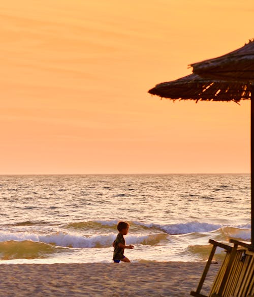 Child Walking on the Beach