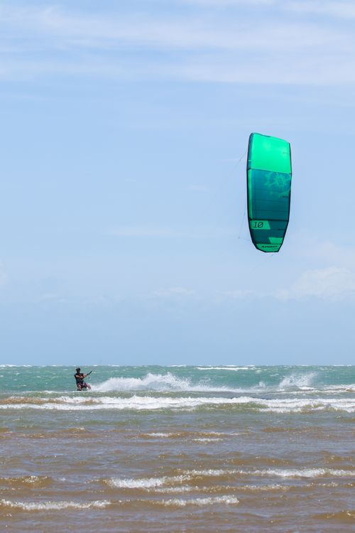 Free Exciting kiteboarding scene in Adicora, Venezuela, showcasing dynamic water sports action. Stock Photo