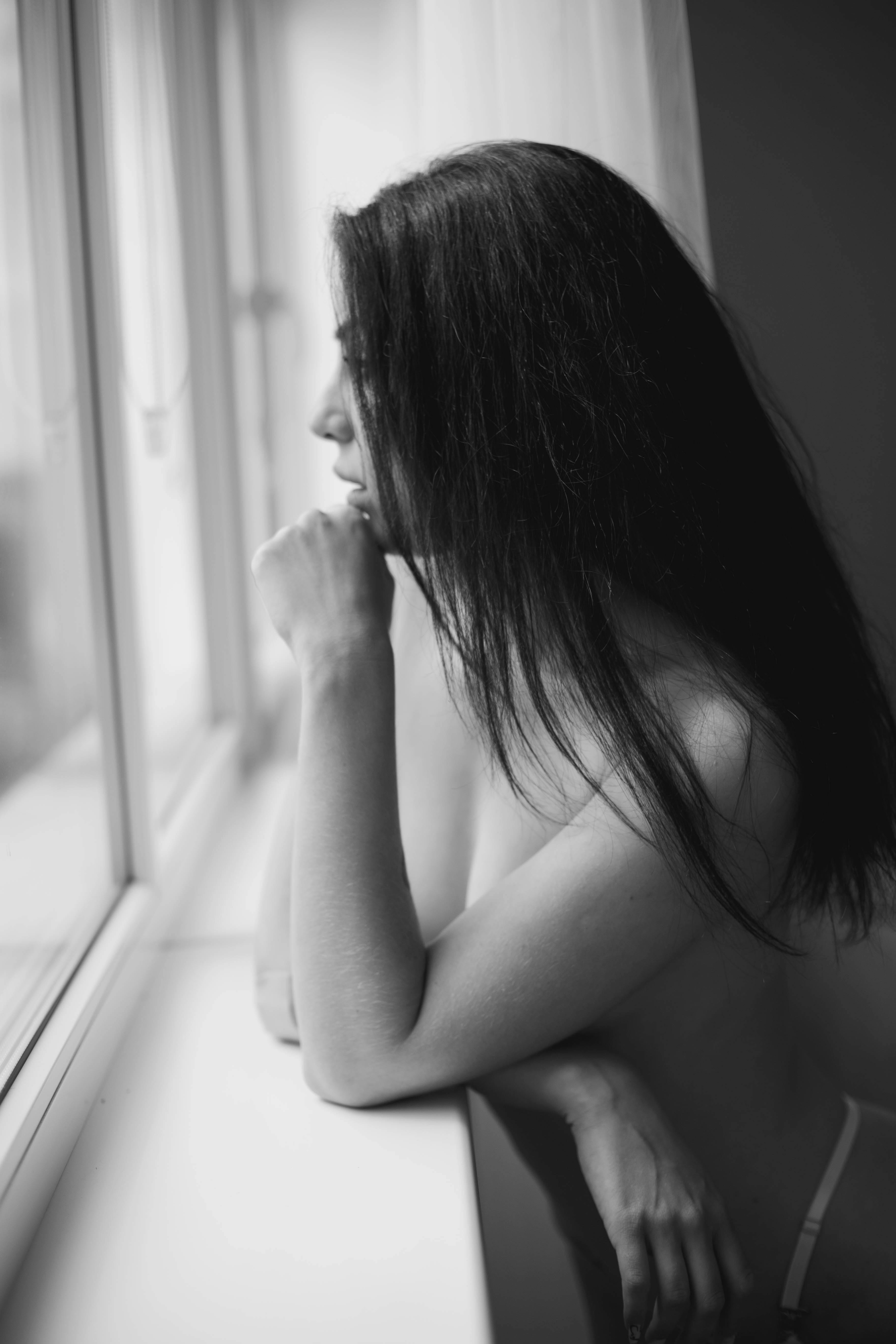 Topless Woman Standing and Looking Outside on a Glass Window · Free Stock  Photo