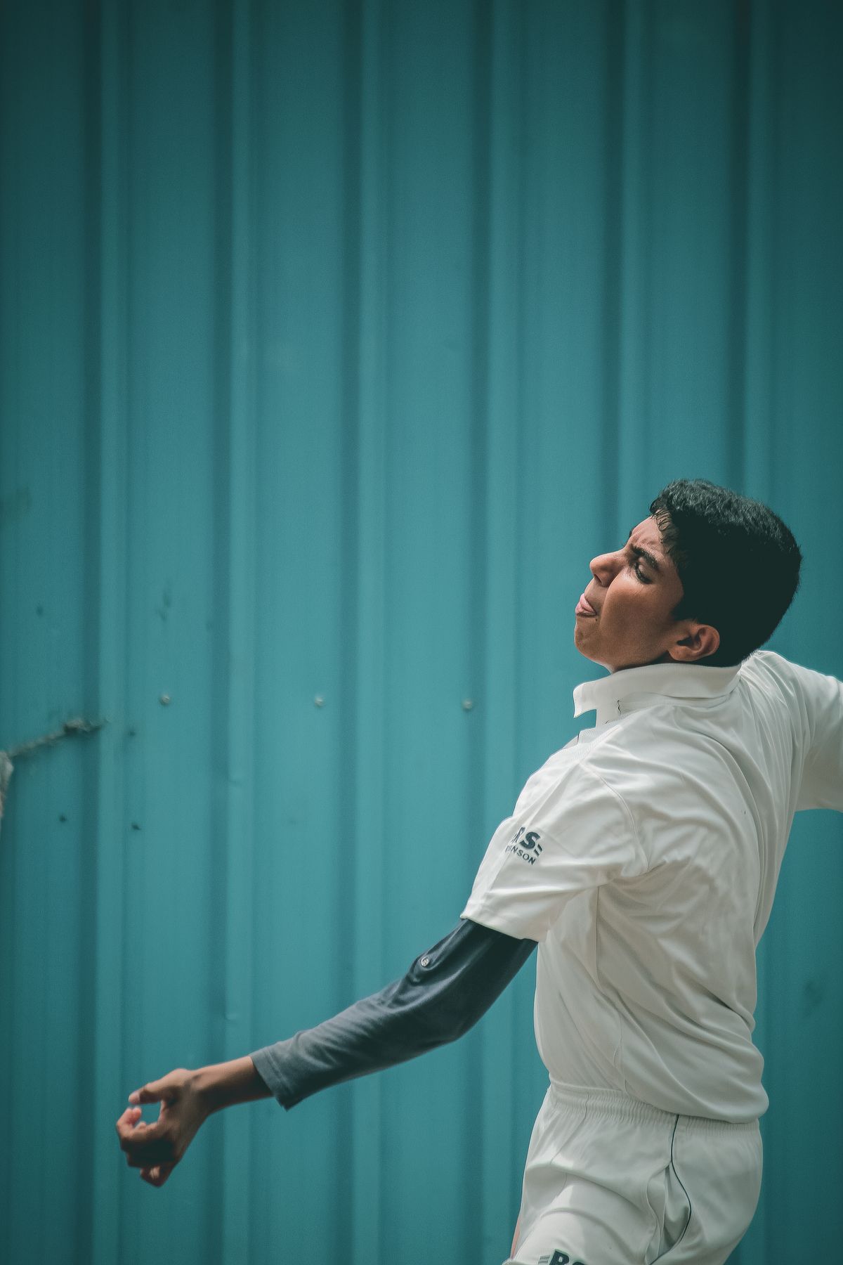 A fast bowler in his delivery stride