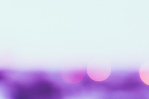 Dreamy pastel abstract bokeh with soft violet and pink hues, creating a tranquil and artistic atmosphere.