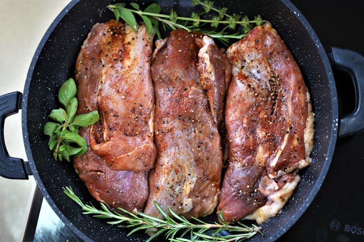 Close-Up Photography Of Marinated Meat In A Pan