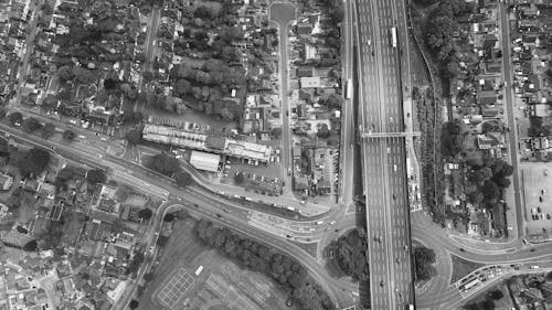 Grayscale Photo of a City with Highway Expressway Roads
