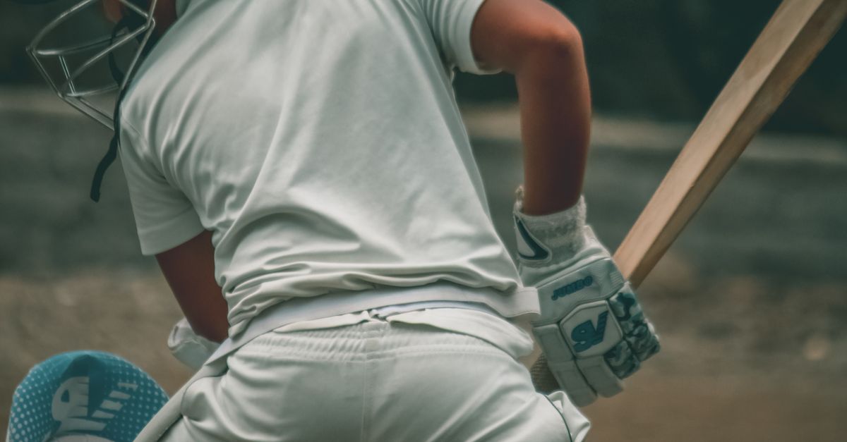 Athlete Holding a Baseball Bat in White Sportswear and Helmet · Free ...