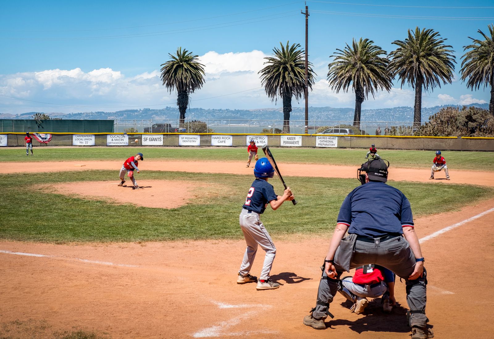 youth baseball game on a sunny local field