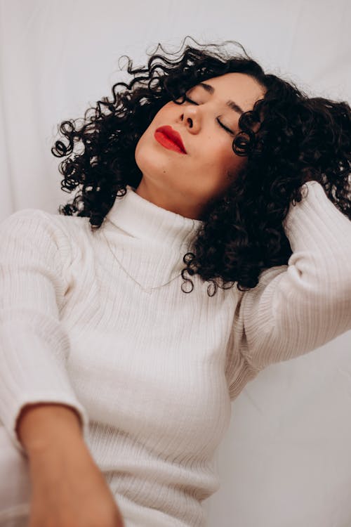 A Woman in White Long Sleeve Shirt