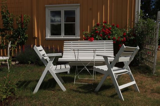 White Wooden Picnic Table on Green Grass Field
