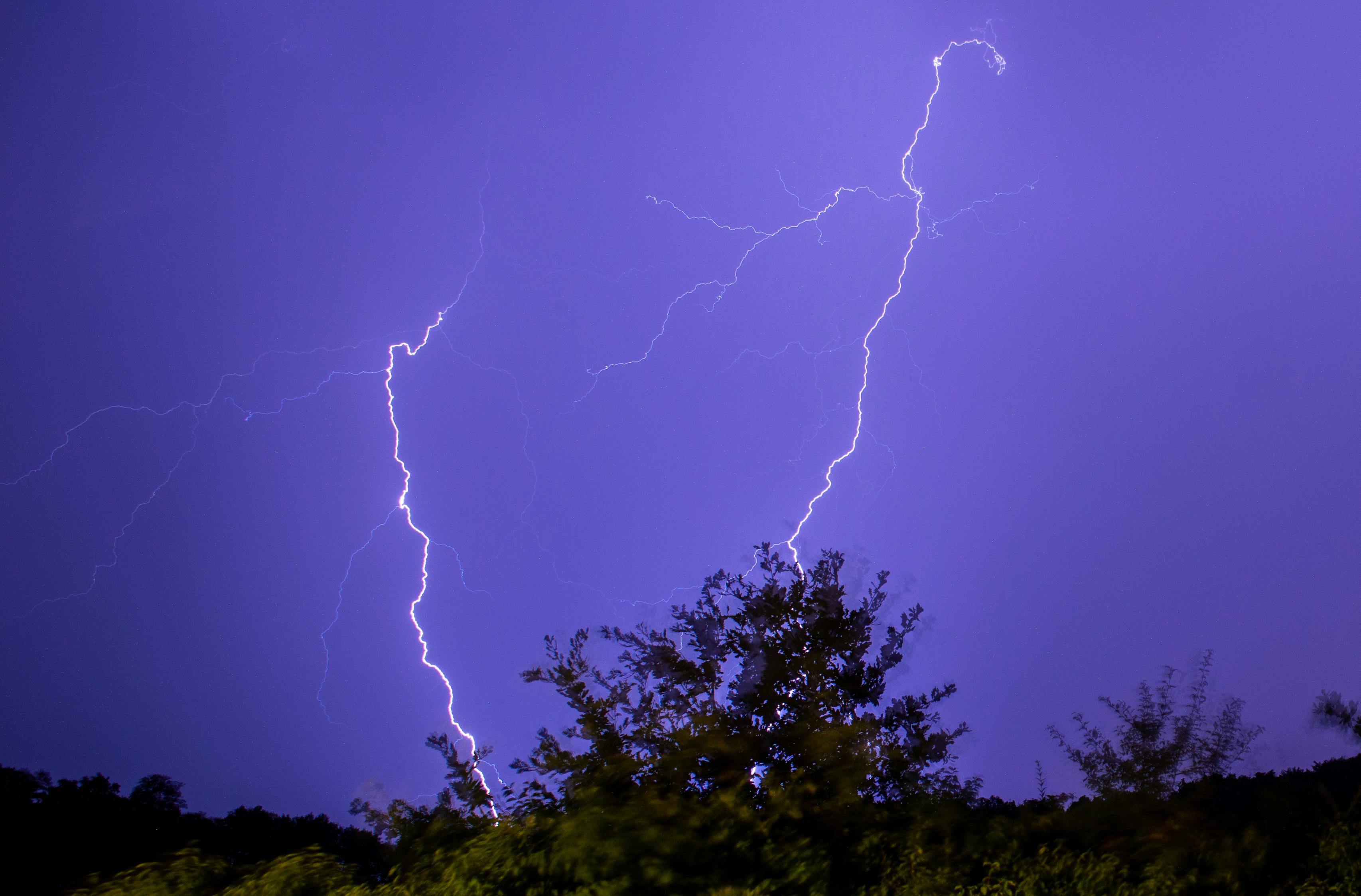 lightnings against purple sky