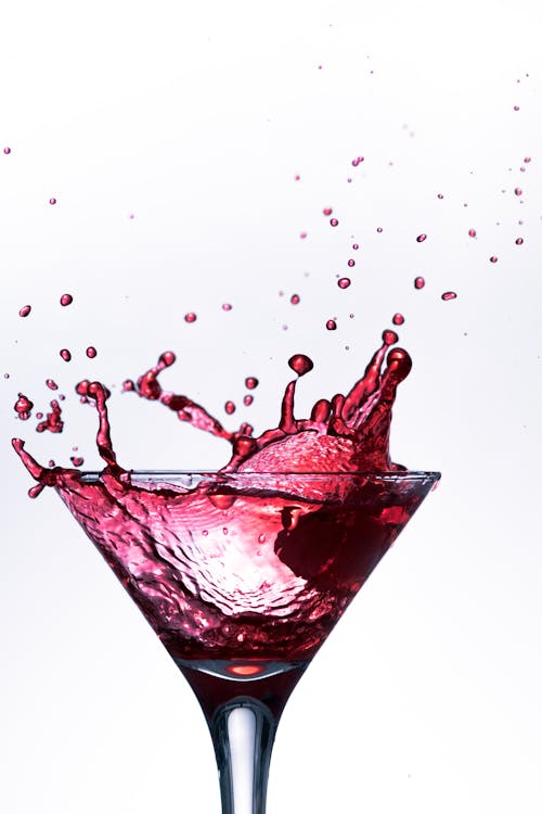 Splashing Beverage in Martini Glass