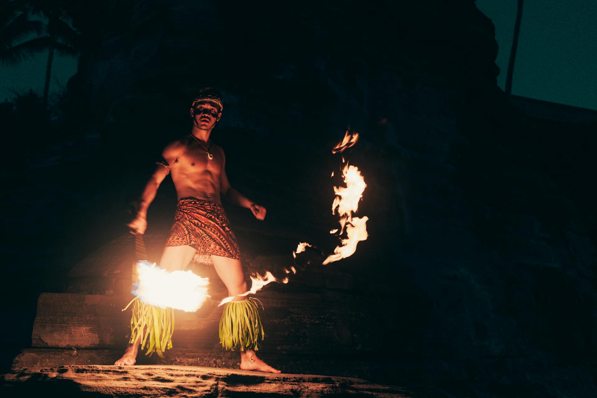 Mesmerizing Polynesian fire dance performed at night, capturing cultural traditions and vibrant artistry.